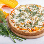 sweet-pumpkin-pie-with-cheese-dill-white-wooden_71985-2796